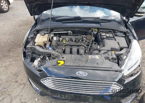 2016 Ford Focus Titanium z USA, uszkodzony, nr VIN 1FADP3J27GL215436